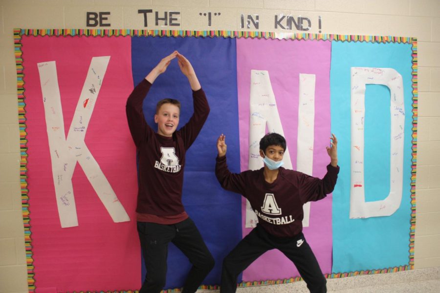 Eighth graders Ethan Hicks and Malikai Sheilds show off their spirit for Put the I in kind month.