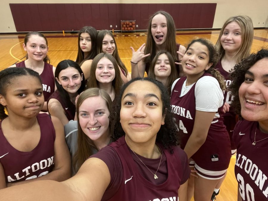The team takes a selfie together on picture day. 