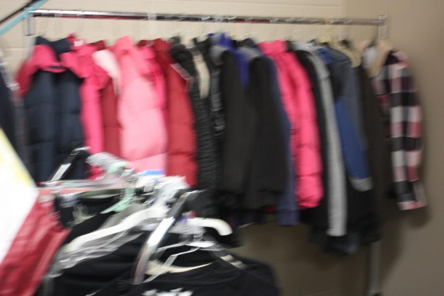 Winter coats are in the corner of the room. So many bright colors.