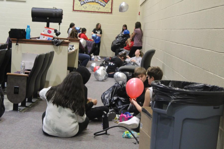 All of the eighth grade student council members prepare for the eighth grade only dance. Students are blowing up balloons. In total there were over 600! Students started at the beginning of fifth period, and they had finished blowing up the balloons around the start of seventh period!