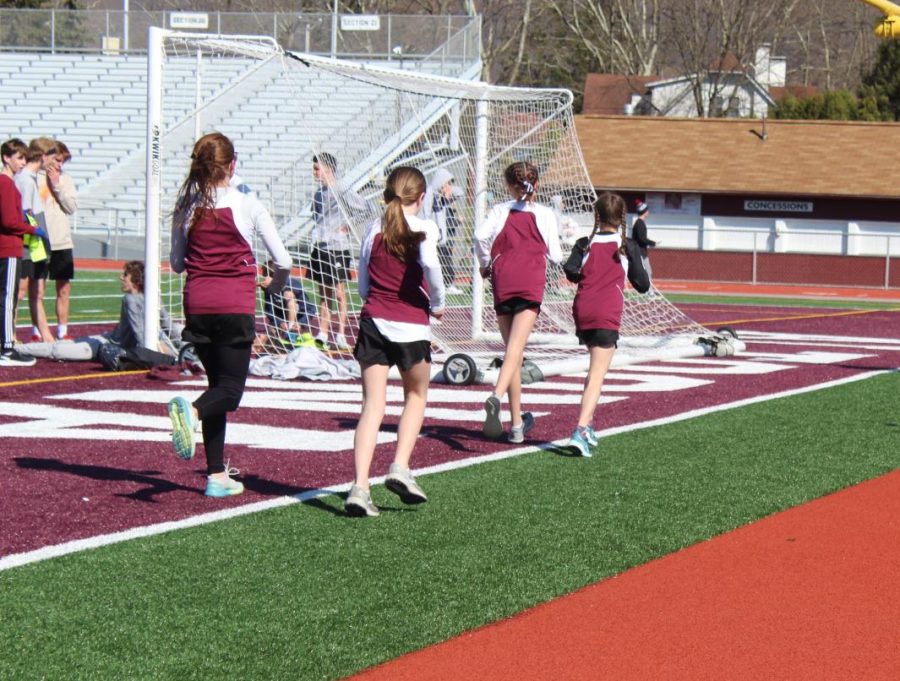 Seventh graders Ashlyn Noice and Lana Luke, eighth grader Brookelyn Weaver and seventh grader Gianna Fiore doing their cool down. A cool down is a slow paced run that runners do after a race so they arent sore later. 