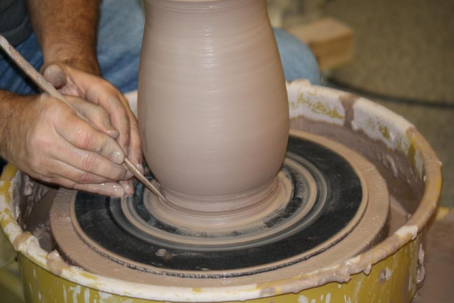 King uses the tool to fix the bottom of the vase. He was extra careful in this step.

