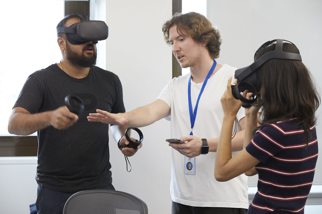 Amazing! As two software engineers explore virtual reality headsets, they also try the control sticks. 