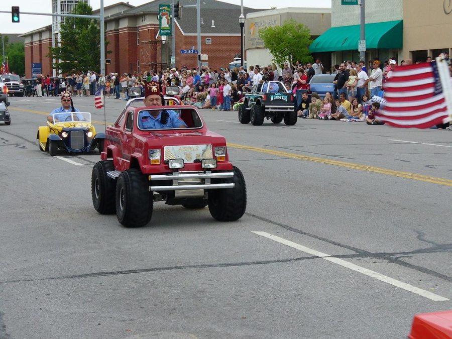 Hit+the+pedal%21+Driving+down+the+road+is+a+Shriner.+They+have+always+driven+cars+at+parades.
