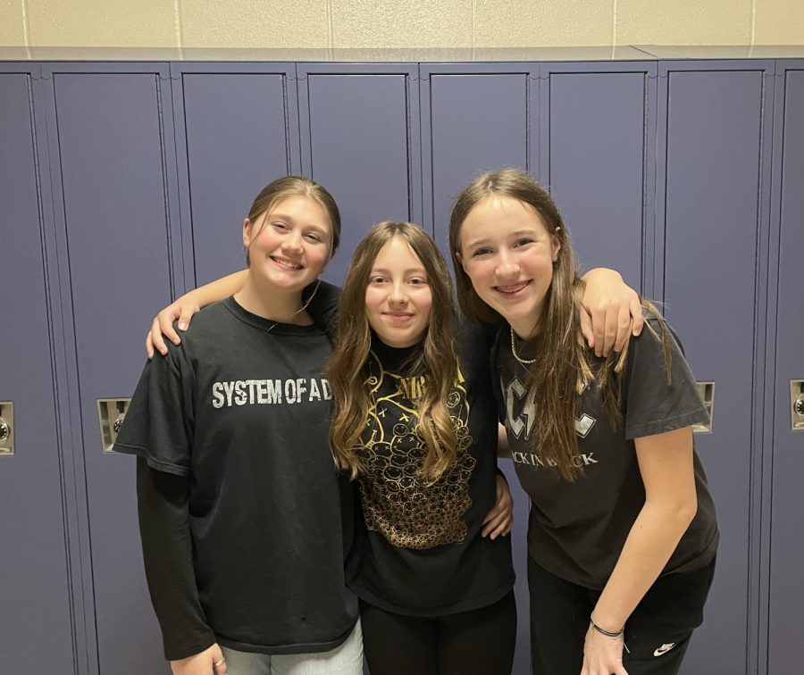 Music madness! Seventh graders Leah Bolvin, Haleigh Martyak and Ava Miller are just some of the students that wear band shirts frequently. Bands like System of a Down, Nirvana and AC/DC are just some of the bands that many people wear. 