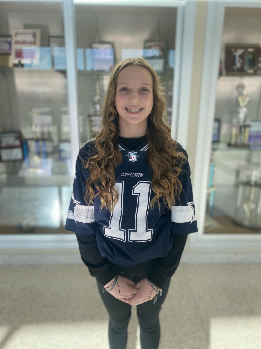 Seventh grader Gracie Albright smiles as she wears her favorite sport jersey! She was so proud to cheer on the Cowboys at school!