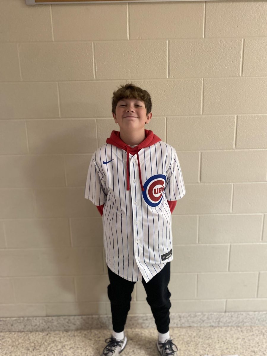 Seventh grader Carter Gibson wears a Chicago Cubs jersey.