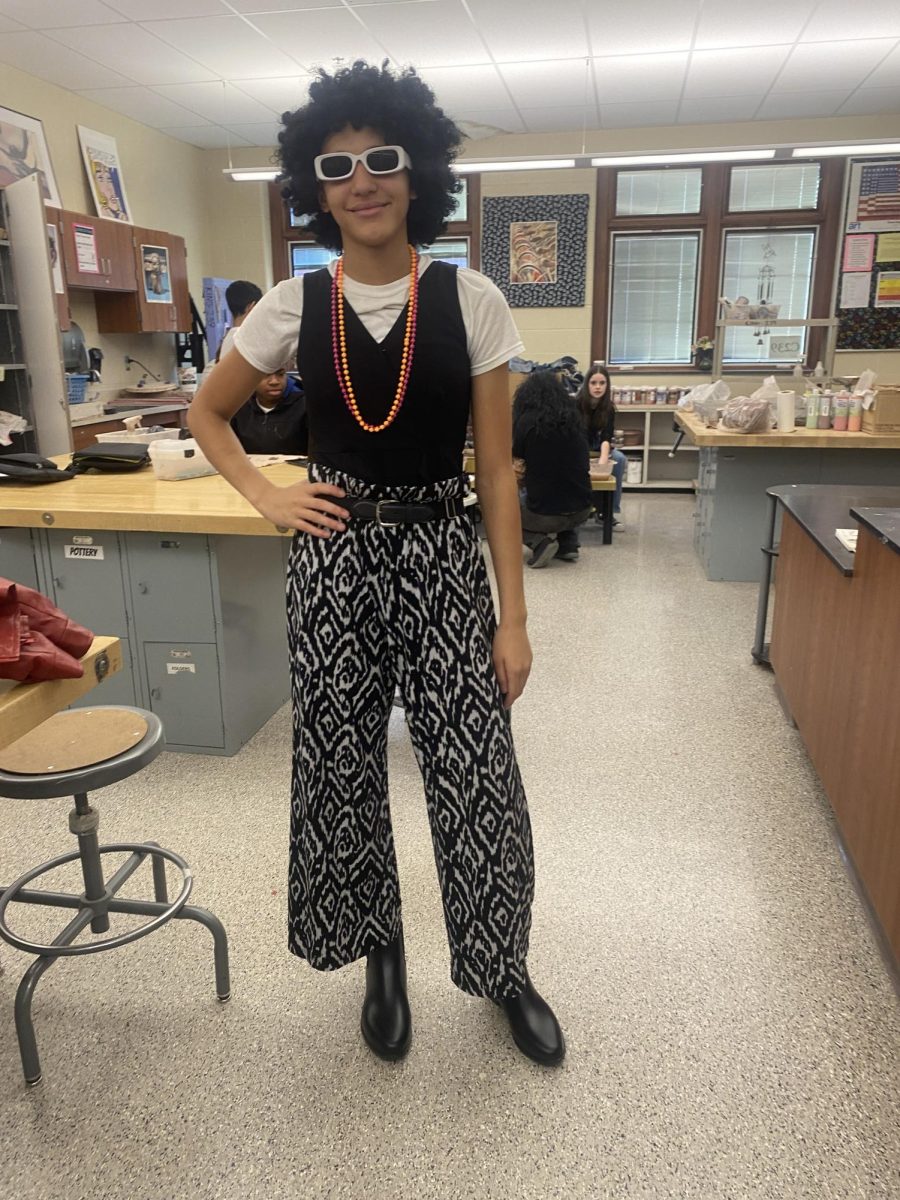 Eighth grader Brionna Hudson strikes a thriller pose as she has on a great outfit for Decades Day! Friday was a blast from the past!
