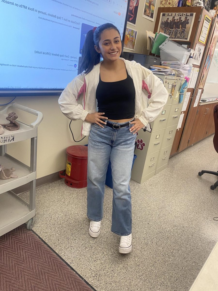 Eighth grader Marissa Rosas smiles in her 80s wear for Decades Day!
