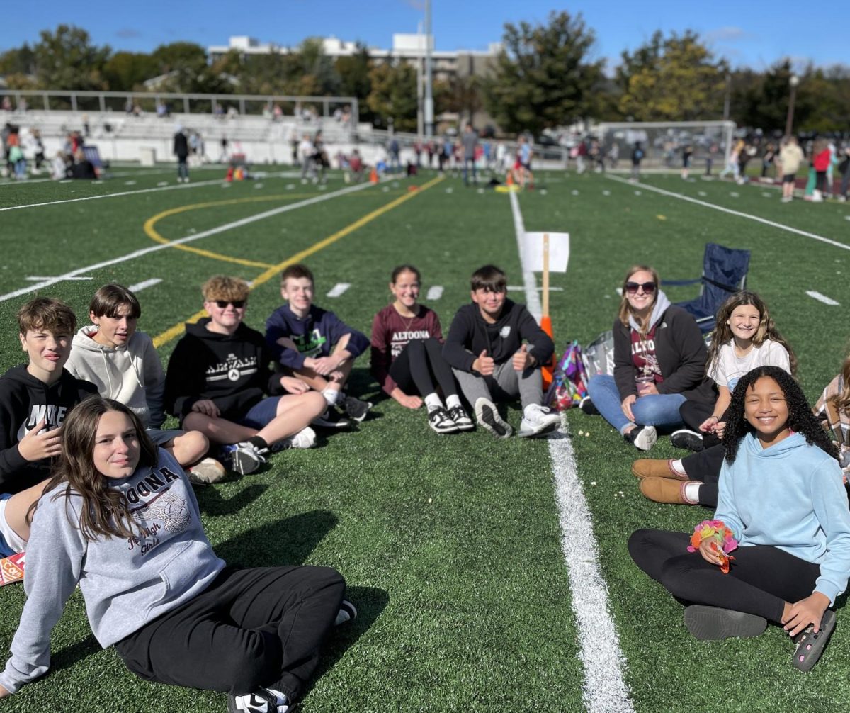 In this photo, seventh grade special education teacher Erika Bailor is seen with multiple other students at the crawl, walk race. They all had a great time at Harvest Day!