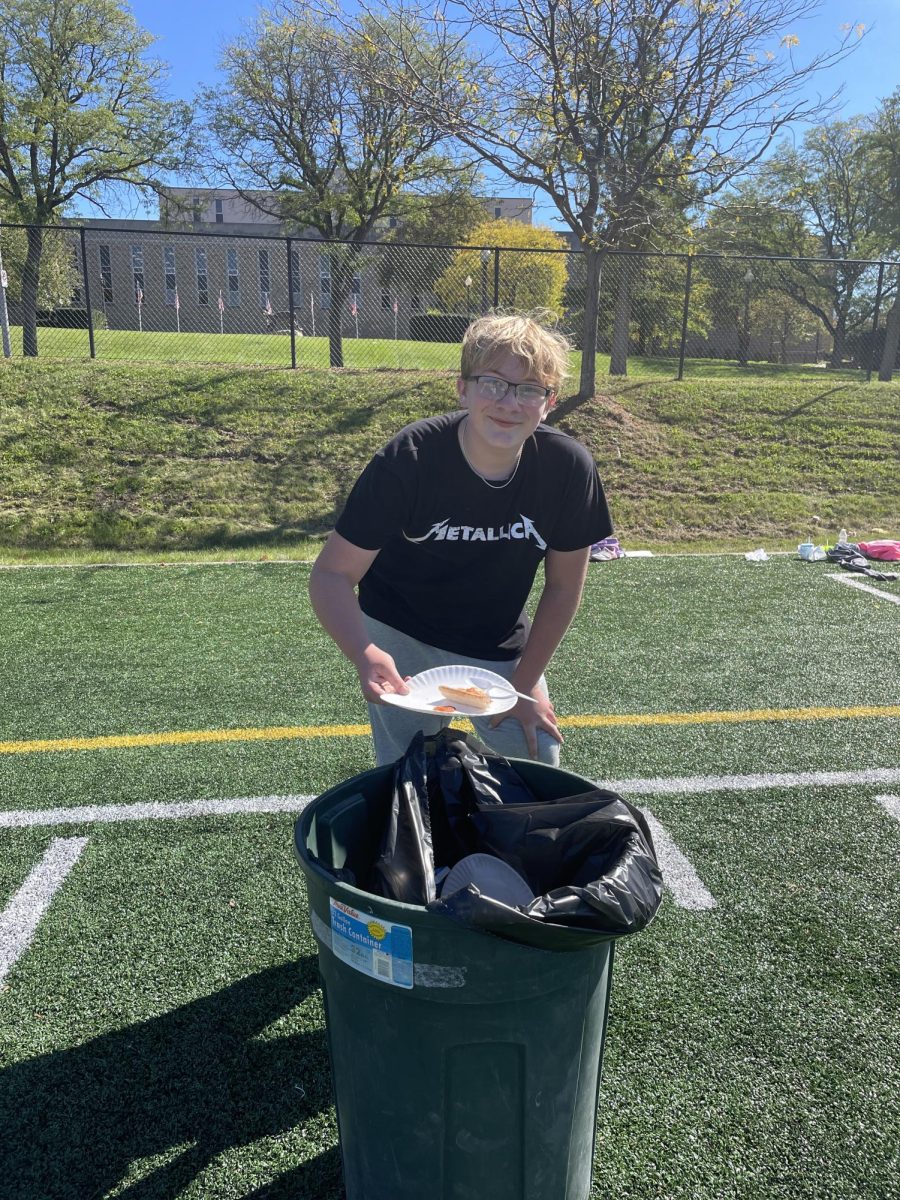 Eighth grader Jaxon Eberhart is seen here helping with the clean up after a long day of fun! There was a lot of trash left over, so his help was much appreciated!