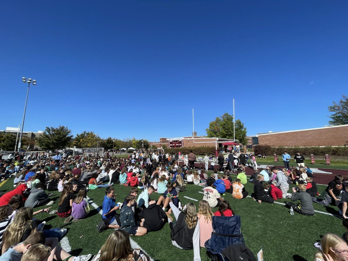 The call is made for the raffle basket winners to be announced. All the Harvest Day attendees file in to see who won! The lucky students who won a basket were thrilled to hear their names being called!