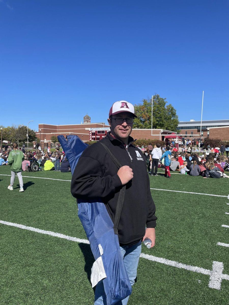 Seventh grade science teacher Skyler Mignogna is seen helping corral the students for the basket raffles. All the students had to make their way over to the crowd, and he was making sure all the students where headed to the right area.