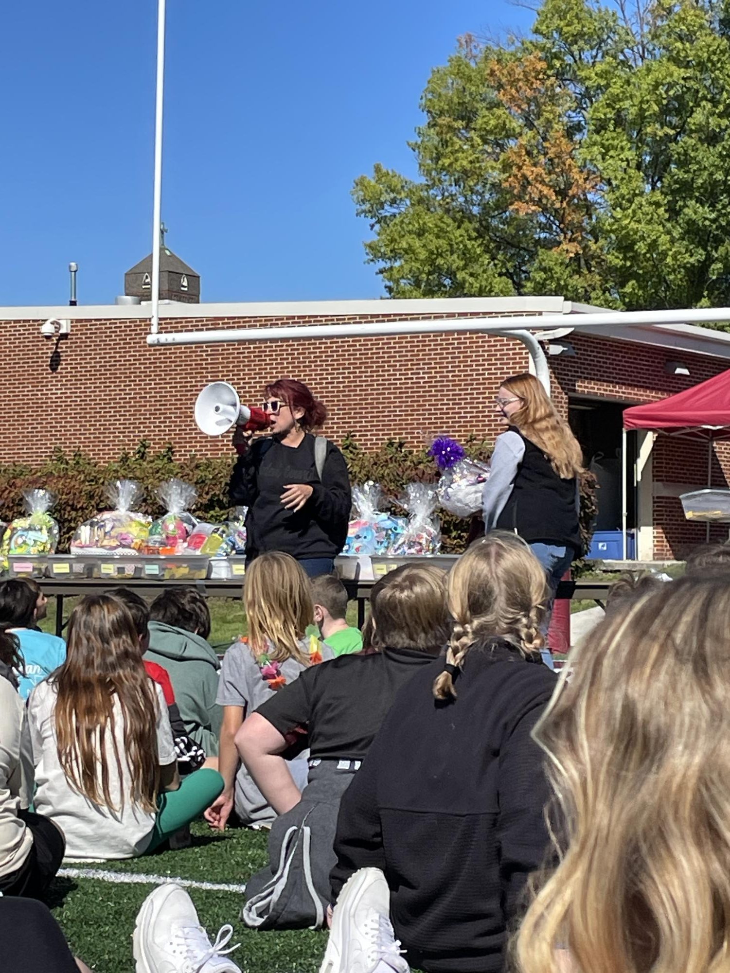 "And the winner is!" said Eighth grade American cultures teacher Elizabeth Bronson when rattling off the names of the basket raffle winners at Harvest Day. 