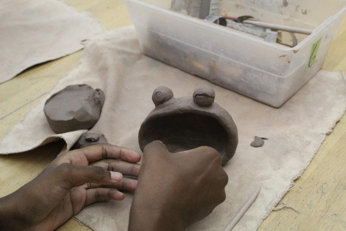 This is so fun! This is eight grader Kanali Gilmore, and she is working on her pinch pot. This is the fourth day she has been working on her pinch pot.