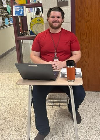 Seeing red! Eighth grade English teacher Aaron Broman participates in the first day of Homelessness Awareness Week by wearing red to show awareness for the millions of homeless people in not only the United States but worldwide.