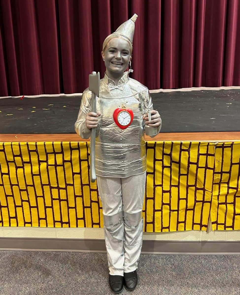 Squeak, squeak! Eighth grader Lila Eamigh smiles big as she wears her Tinman costume after her performance in the drama play "The Wizard Of Oz." The play concluded the weekend before break, and they performed a total of five shows!