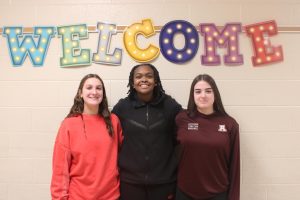 So cute. Eight graders Kharisma Davis, Leah Nedimyer and Bynn Plunket are all posing for a photo. They all play basketball and have been playing for a long time. " I love basketball it is my life," said Davis.