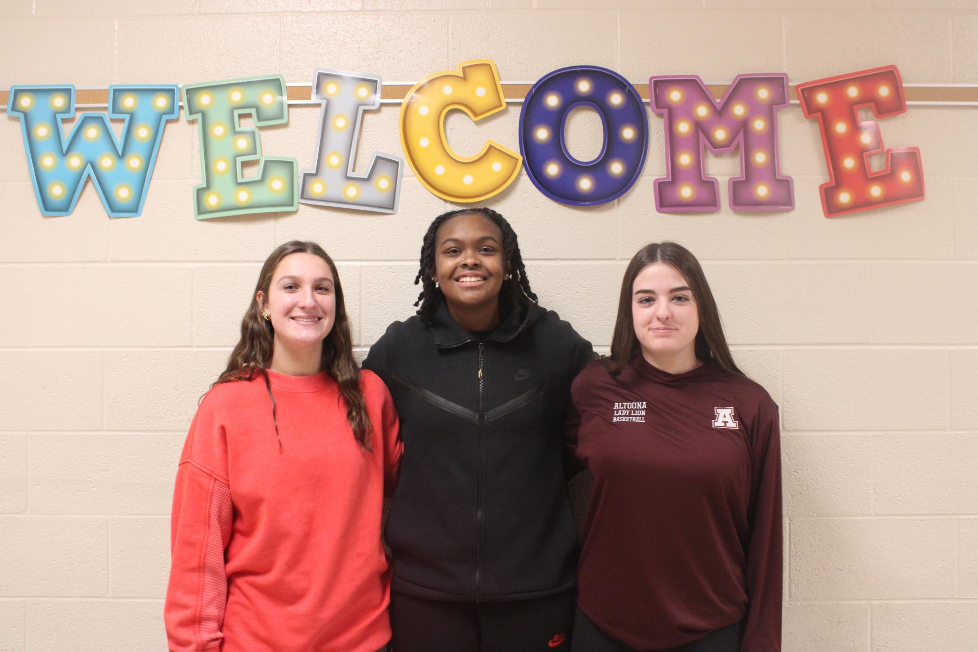 So cute. Eight graders Kharisma Davis, Leah Nedimyer and Bynn Plunket are all posing for a photo. They all play basketball and have been playing for a long time. " I love basketball it is my life," said Davis.