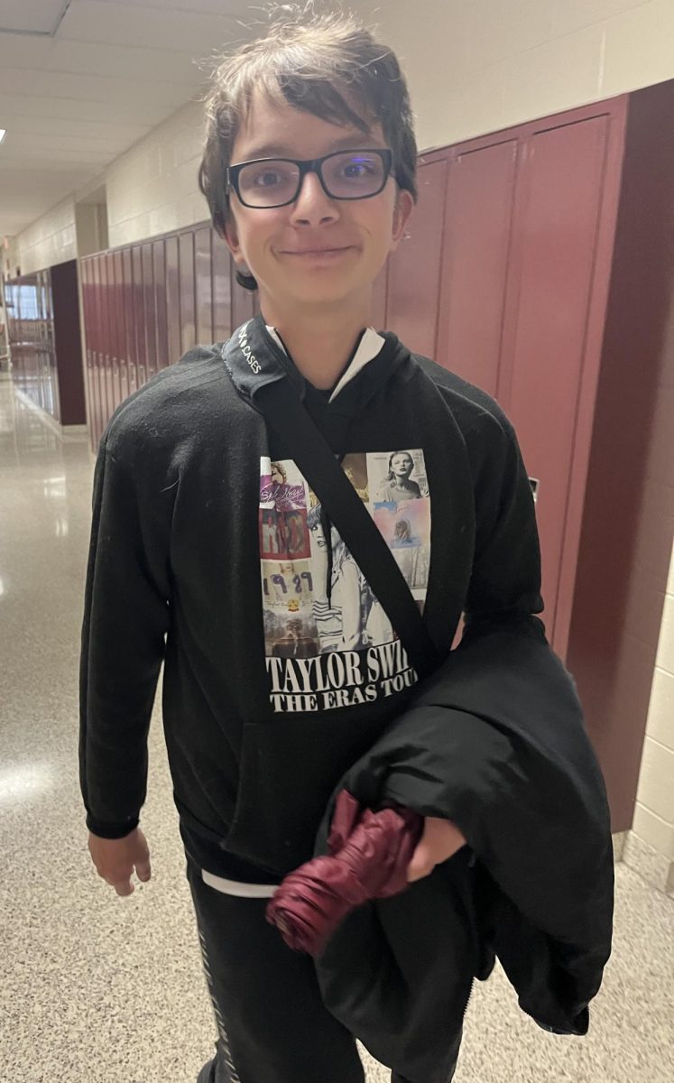 Toss, toss! Eigth Grader Quincy Lanzendorfer struts around school wearing his expensive, Taylor Swift themed clothes.