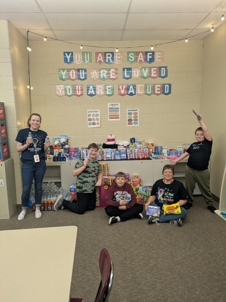  Seventh grade special education teachers Lindsay Smith and Sue Estraight along with seventh grade students Ethan Wyland, Devlin Gartland and sixth grader Zavier Grum pose with some of the items they collected for the teen shelter!