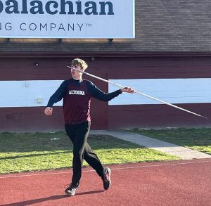 Hurl! Patrick Port is winding up to throw! He is throwing the javelin and scored crucial points for the team.