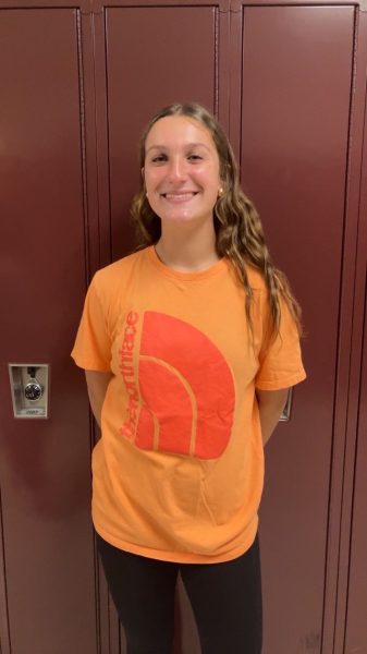 Smile! Eight grader Leah Nedimyer is smiling nice and big. Nedimyer just finished passing out year books. "I love wearing comfy clothes," said Nedimyer.