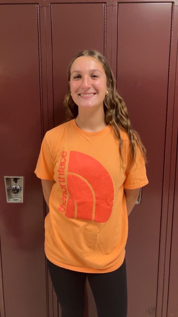Smile! Eight grader Leah Nedimyer is smiling nice and big. Nedimyer just finished passing out year books. "I love wearing comfy clothes," said Nedimyer.
