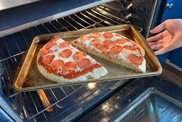Step 7. Once your oven is heated to the correct temperature, it's time to load it with your pizza. Make sure that when your time goes off, that you get your pizza out quickly so it does not burn.